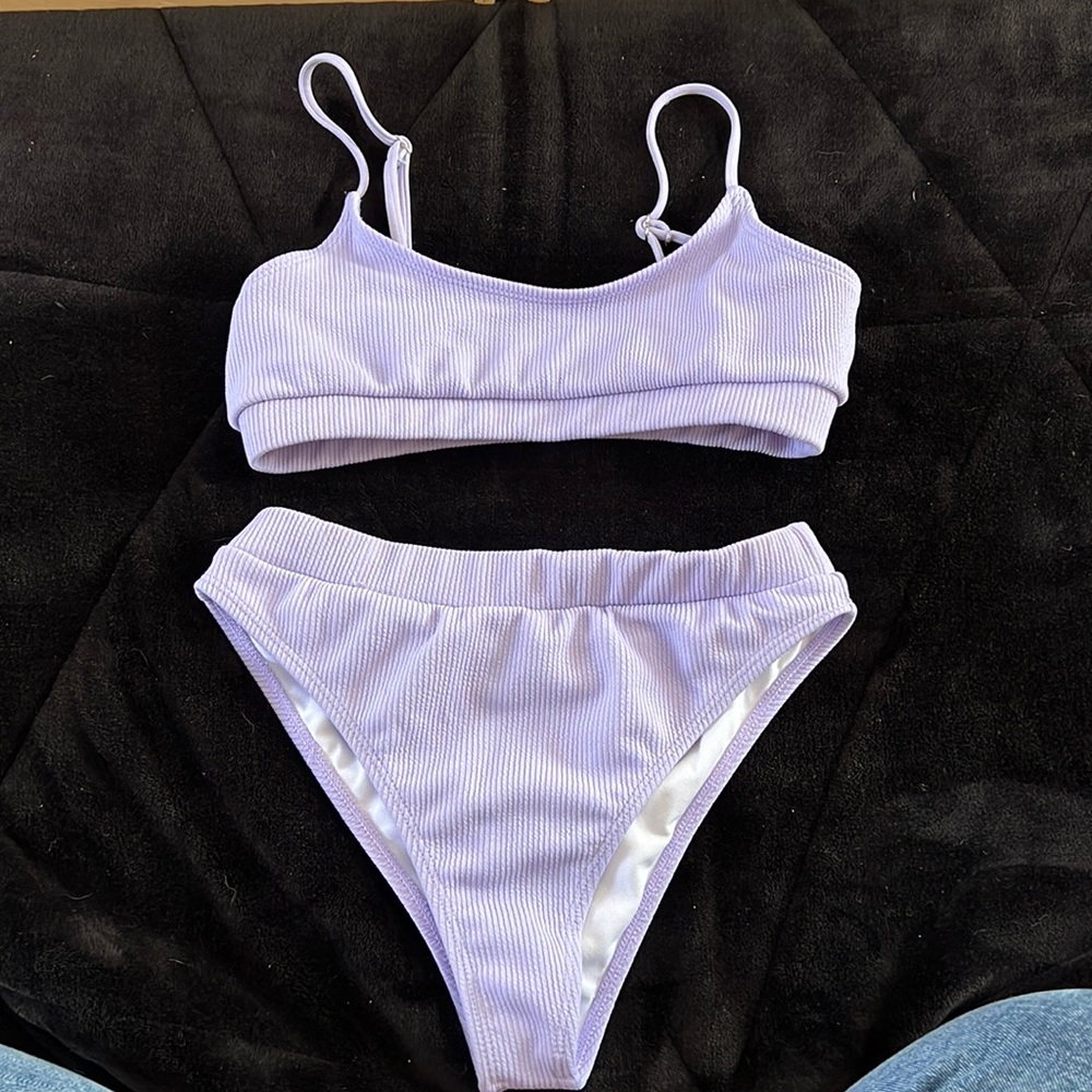 Woman’s purple bikini